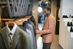 Young african man shopping in clothing store